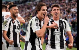 Juventus’ Kenan Yildiz (centre) celebrates after scoring the opening goal during the Champions League first phase match between Juventus and PSV Eindhoven at the Juventus stadium in Turin, Italy yesterday.