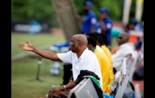 Coach Lebert Halliman  remonstrates while sitting on the sidelines during a football match. Halliman likened his coaching stint at Camperdown High to ‘getting basket to carry water’. 