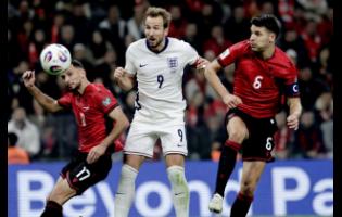 Credit: Vlasov Sulaj England’s Harry Kane (centre) scores his side’s second goal as Albania’s Naser Aliji (left) and Berat Djimsiti try to stop him during the World Cup 2026 group K qualifying soccer match in Tirana, Albania, yesterday. England won 2-0.