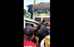 Credit: Contributed Dancehall artiste Teejay hands out care packages to residents in his hometown of Glendevon, Montego Bay, as part of his Hurricane Melissa relief efforts.