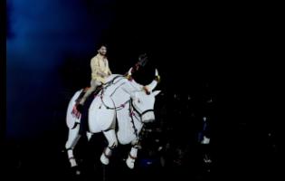Credit: AP Tollywood superstar Mahesh Babu rides a mechanical bull at the unveiling of first look of film “Varanasi” in Hyderabad, India, on Saturday.