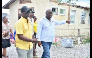 Minister of Local Government and Community Development, Desmond McKenzie (left), and Mayor of Savanna-la-Mar, Councillor Danree Delancy, tour a section of the Westmoreland Infirmary.  