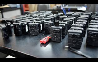Credit: Contributed Body-worn cameras on display at the Police Commissioner’s Office in St Andrew yesterday (File Photo)