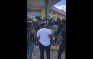 Credit: Screengrab from contributed video Students of the College of Arts, Science and Education in Portland protest after a fellow student was reportedly attacked on the campus on Sunday.