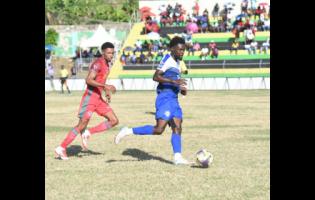 Mount Pleasant Academy’s Kyle Ming (right) tries to outrun Montego Bay United’s Timar Lewis during their Jamaica Premier League game at Jarrett Park on Sunday, December 28, 2025.