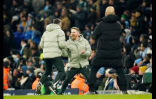 Chelsea’s head coach Calum McFarlane (centre) celebrates after Enzo Fernandez scored during the English Premier League soccer match against Manchester City in Manchester, England, on Sunday. The game ended 1-1.
