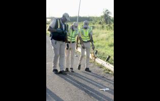 Crash investigators on a scene late last year.
