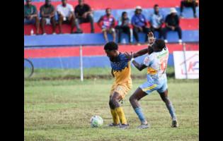 Racing United’s Marcovich Brown shields the ball from Waterhouse’s Javane Bryan during their Jamaica Premier League match at Ferdi Neita Park on Sunday, January 4, 2026.
