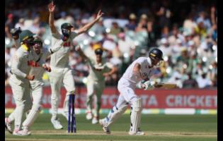 Australian players celebrate after England’s Ben Stokes (right) was dismissed during play on day four of the third Ashes cricket Test.