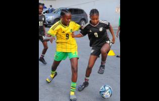 Reggae Girl Shaniel Buckley (right) is challenged by Ricquanna Richards during a mock session at the Jamaica Football Federation in July, 2023. 