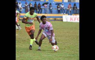 Credit: Ashley Anguin All-Manning’s Kimarly Scott (right) shields the ball from All-daCosta’s Orane Gayle during the ISSA All-daCosta versus All-Manning playoff match at the St Elizabeth Technical Sports Complex on Saturday, January 10, 2026.
