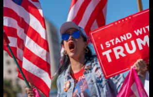 Maribel Gonzalez celebrates outside Versailles Cuban Cuisine after President Donald Trump announced President Nicolás Maduro had been captured and flown out of Venezuela.