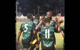 Jamaica’s Reggae Boyz celebrate at the end of yesterday’s friendly against Grenada at the Kirani James Stadium in St George’s Grenada. Jamaica won 1-0.