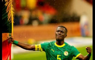 Senegal’s Idrissa Gueye celebrates after winning the Africa Cup of Nations final match against Morocco in Rabat, Morocco, yesterday.