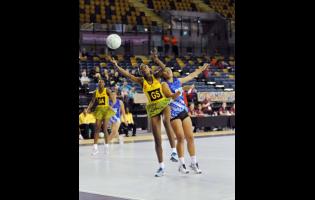 Jamaica’s Simone Gordon (GS) reaches for the ball while challenged by Analina Tone of Samoa.
