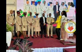 Rev Dr Otis Manning, Pastor, presents the St Andrew North Management team with a plaque 
