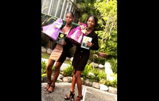  Crystel (left) and Crystal Thomas show off their awards.
