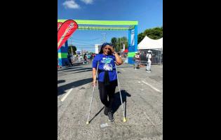 Tameika Gordon-Clarke at the finish line of the Sagicor Sigma Run on Sunday.