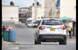 Credit: File A police service vehicle patrols the west Kingston community of Denham Town.
