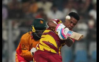 West Indies’ Shimron Hetmyer hits a six during the T20 World Cup cricket match between Zimbabwe and West Indies in Mumbai, India, on Monday.