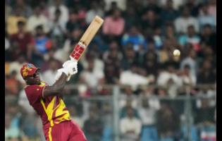 West Indies’ Rovman Powell plays a shot during the T20 World Cup cricket match between Zimbabwe and West Indies in Mumbai, India, on Monday.