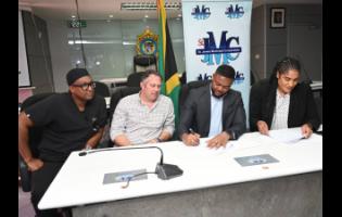 From left: Germaine Spencer, president of Montego Bay United, Yoni Epstein, head of Montego Multi-Sports Development Ltd, Richard Vernon, chairman of St James Municipal Corporation and Mayor of Montego Bay, and Corporation CEO Naudia Croskill at a ceremony yesterday to sign a 25-year lease agreement for the redevelopment of the Montego Bay Sports Complex. 