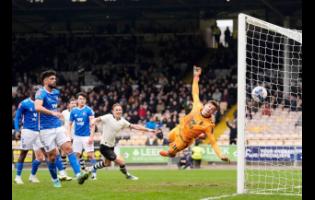 Port Vale’s Ben Waine (second right) scores his side’s first goal of the game, during the FA Cup fifth-round soccer match against Sunderland in Stoke on Trent, England, on Sunday.