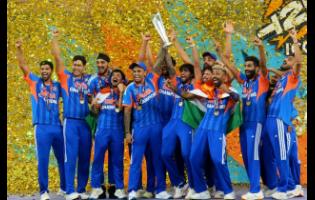 India’s players celebrate with the trophy after winning the T20 World Cup final cricket match against New Zealand, in Ahmedabad, India, on Sunday.