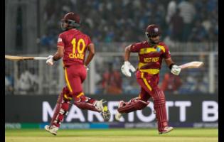West Indies’ captain Shai Hope (right) and batting partner Roston Chase run between the wickets during the T20 World Cup cricket match against India in Kolkata, India on Sunday, March 1.