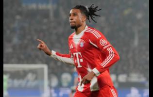 Bayern’s Michael Olise celebrates after scoring his side’s fifth goal during the Champions League round-of-16 soccer match between Atalanta and FC Bayern Munich in Bergamo, Italy, yesterday.