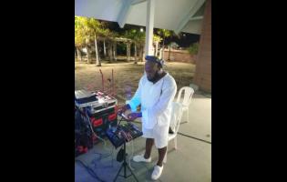 The ‘iPhone DJ’ Ricardo Williams playing some tunes with his phone hooked up to a mixing board.