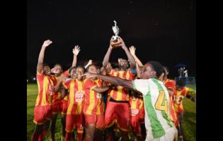 Cornwall College players celebrate winning the 2026 ISSA/Burger King rural Under-16 football title at St Elizabeth Technical High School on Thursday. Cornwall defeated Glenmuir High School 4-1.