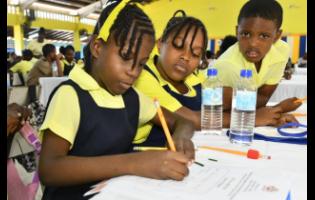 Credit: Michael Sloley Photos Students of Green Island Primary School participate in solving equations during the 2026 Mathematics Problem-Solving Competition finale, held on March 12 at Merl Grove High School in Kingston.