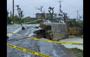 Credit: Contributed A section of roadway in Belmont, Westmoreland has broken away following heavy rainfall and rough sea conditions, forcing traffic to be reduced to a single lane.