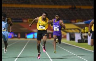 Excelsior High School’s Riquelme Reid dips at the line to win the Class One boys’ 100m final at the ISSA/GraceKennedy Boys and Girls’ Athletics Championships at the National Stadium in Kingston on Wednesday, March 25, 2026.
