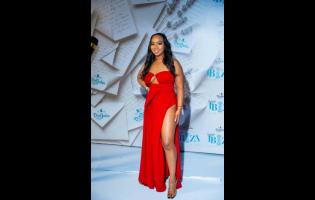 Swagg Mumma turns heads in fiery red, owning the spotlight with bold confidence at Daylight Ibiza’s chic Easter Sunday affair at Hope Gardens, St Andrew.