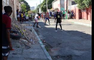 Credit: FILE Residents play football as part of a peace initiative.