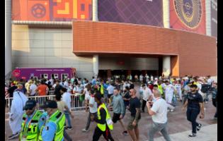 FILE - Fans arrive for the World Cup group B soccer match between England and Iran at the Khalifa International Stadium Doha, Qatar, on Monday, November 21, 2022.