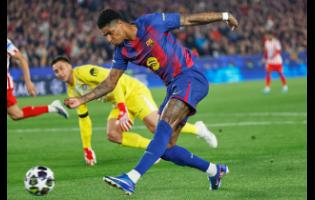 Barcelona’s Marcus Rashford makes an attempt to score during the Champions League quarterfinal first leg soccer match against Atletico Madrid in Barcelona, Spain, on Wednesday.