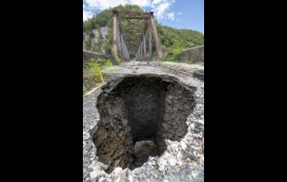 The gaping hole in the Easington Bridge in St Thomas through which 90-year-old Raphael Bryan fell on Good Friday, leading to his death.