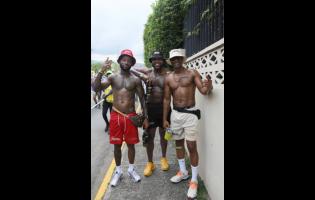Linking up with the bros while on the road, Nino Adair (left) poses with David Mathie (centre) and Ferhandi Henry.