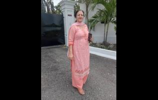 Credit: Tanuya Joshi, a visitor from India, captures the vibrant colours and energy of Carnival in Jamaica along East Kings House Road in St Andrew on April 12, 2026.