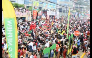 Members of Yard Mas make their way along Hope Road during yesterday’s road march.