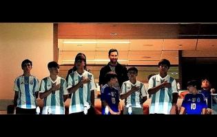 Argentina forward Lionel Messi (centre, top) watches from a box with family and friends at the start of an international friendly soccer match between Venezuela and Argentina on October 10, 2025, in Miami Gardens, Florida.