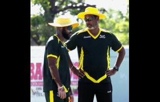 Jamaica Sorpions coach Robert Haynes (right) chats with captain John Campbell during the West Indies Championship cricket match against Barbados Pride at Chedwin Park on Wednesday.