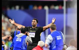 Jamaica’s Roje Stona celebrates an Olympic record-breaking gold-medal performance in the men’s discus at the Stade de France in Paris, France, on Wednesday, August 7, 2024.