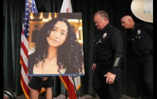 LAPD Chief Jim McDonnell walks past an image of Celeste Rivas Hernandez Monday, April 20, 2026, in Los Angeles after a press conference regarding the case of singer D4vd, who was charged on suspicion of killing the 14-year-old girl whose dismembered body was found in his car. (AP Photo/Damian Dovarganes)