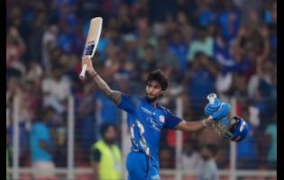 Mumbai Indians’ Tilak Verma celebrates his century during the Indian Premier League cricket match against Gujarat Titans in Ahmedabad, India, on Monday.
