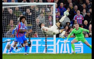West Ham United’s Taty Castellanos tries an overhead kick during the English Premier League soccer match against Crystal Palace in London, England, on Monday.