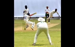 Barbados Pride captain Kraigg Brathwaite (second left) evades a sharp bouncer from Jamaica Scorpions fast bowler Ojay Shields on day two of their West Indies Championship cricket match at Sabina Park.